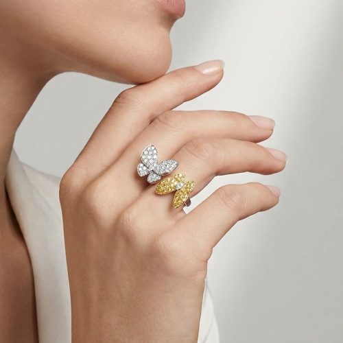 Two Butterfly Between The Finger Ring